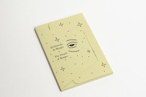 Borges' Oracle (El Oráculo de Borges) by Errant Press — book in its envelope cover with eye and stars